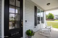 5028 Laurenbridge Lane, Wilmington, NC 28409 — 3-bedroom home in Laurenbridge, Wilmington, NC, photo 4 of 50: Laurenbridge5028-2fprchShaneL33A5322 cop