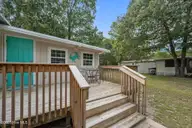 618 Creek Drive, Hampstead, NC 28443 — 3-bedroom manufactured home in Cedar Landing, Hampstead, NC, photo 6 of 51: Spacious Deck