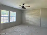 316 Commodore Drive, Rocky Mount, NC 27801 — 3-bedroom manufactured home in Eastfield, Rocky Mount, NC, photo 10 of 32: Den view 1