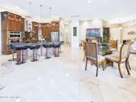8900 Mahogany Run, Wilmington, NC 28411 — 3-bedroom home in Porters Neck Plantation, Wilmington, NC, photo 13 of 75: 24-web-or-mls-25_STILL099_kitchen-and-di