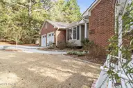 245 Firetree Lane, Seven Lakes, NC 27376 — 3-bedroom home in Seven Lakes North, Seven Lakes, NC, photo 21 of 27: Front yard
