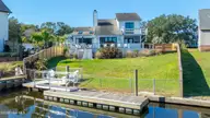 212 Teakwood Drive, Carolina Beach, NC 28428 — 3-bedroom waterfront home in Pleasure Cay, Carolina Beach, NC, photo 1 of 46: Back Elevation