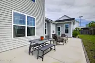 166 N Passerine Path, Hampstead, NC 28443 — 4-bedroom home in Songbird Landing, Hampstead, NC, photo 22 of 70: Backyard patio