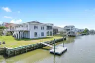 402 Dolphin Street, Sunset Beach, NC 28468 — 3-bedroom waterfront home, Sunset Beach, NC, photo 10 of 53: Virtually Maintenance Free Boat Dock