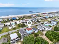 1616 E Dolphin Drive, Oak Island, NC 28465 — 4-bedroom waterfront home in Long Beach, Oak Island, NC, photo 2 of 55: Kahunaphoto.com-