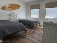 283 Salter Path Road 115, Pine Knoll Shores, NC 28512 — 2-bedroom waterfront condo in Pine Knoll Townes, Pine Knoll Shores, NC, photo 9 of 15: Bedroom 2