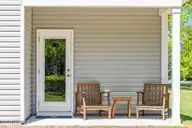 504 Sandy Hollow Drive, Jacksonville, NC 28540 — 4-bedroom home in Sandy Hollow, Jacksonville, NC, photo 1 of 22: Covered back porch