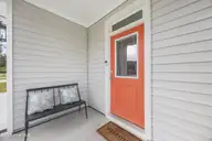 1080 Ben Thomas Drive NE, Leland, NC 28451 — 4-bedroom home in Coastal Haven, Leland, NC, photo 5 of 45: Front Porch (5)