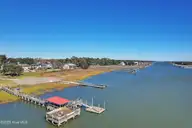 2021 106&107 Sea Lavender Road SW, Supply, NC 28462 — waterfront lot in Marsh Acres, Supply, NC, photo 19 of 19: View of Day Dock and Fishing Pier
