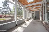 60 Oak Meadow Road, Pinehurst, NC 28374 — 4-bedroom home in Fairwoods on 7, Pinehurst, NC, photo 18 of 67: ScreenedPorch1
