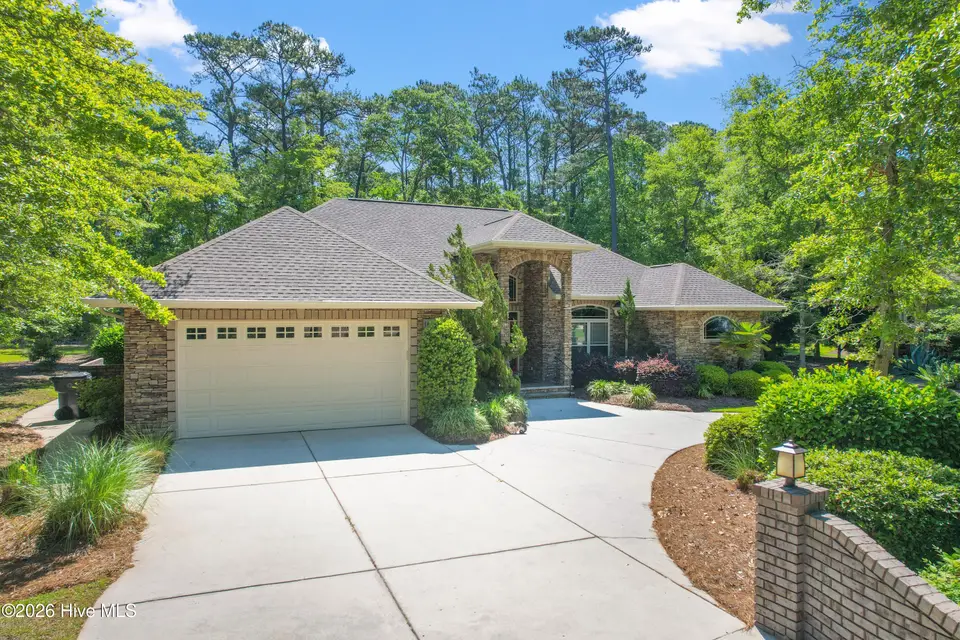 1614 Colonist Square SW, Ocean Isle Beach, NC 28469 — 3-bedroom home in Brick Landing, Ocean Isle Beach, NC, photo 1 of 63: Front of home
