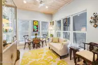 503 W Yacht Drive, Oak Island, NC 28465 — 4-bedroom home in Tranquil Harbor, Oak Island, NC, photo 14 of 53: Sunroom 2