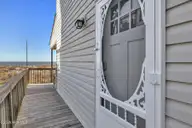 4319 E Beach Drive, Oak Island, NC 28465 — 3-bedroom waterfront home, Oak Island, NC, photo 2 of 55: 02-Final 4319 E Beach Dr OKI-RJREM-0645