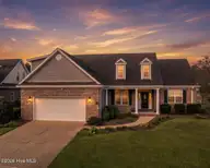 2209 Talmage Drive, Leland, NC 28451 — 4-bedroom waterfront home in Brunswick Forest, Leland, NC, photo 1 of 34: Front Elevation