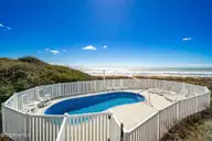 1819 Salter Path Road, Indian Beach, NC 28512 — 5-bedroom waterfront home in Roosevelt Estate, Indian Beach, NC, photo 3 of 58: In ground pool in back