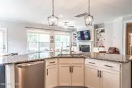 357 Wheatfield Way, Whispering Pines, NC 28327 — 5-bedroom home in Summerfield at Arrowstone, Whispering Pines, NC, photo 10 of 44: Kitchen with Stainless Steel Appliances