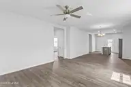 1099 Hanson Drive, Leland, NC 28451 — 3-bedroom home in East Lake, Leland, NC, photo 13 of 16: Nest - Great Room_Casual Dining_Kitchen