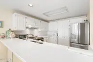 331 Salter Path Road 311, Pine Knoll Shores, NC 28512 — 3-bedroom waterfront condo in Beachwalk, Pine Knoll Shores, NC, photo 16 of 55: Kitchen bar