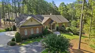 11 Whithorn Court, Pinehurst, NC 28374 — 3-bedroom home in Pinewild CC, Pinehurst, NC, photo 2 of 50: 3-web-or-mls-DJI_20260715093114_0731_D