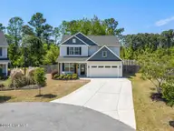 1011 E Arboria Drive, Hampstead, NC 28443 — 4-bedroom waterfront home in The Arbors, Hampstead, NC, photo 1 of 76: Front photo 1