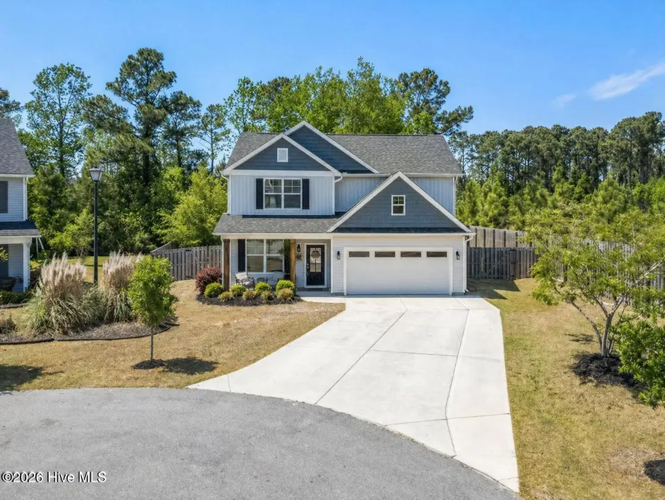 1011 E Arboria Drive, Hampstead, NC 28443 — 4-bedroom waterfront home in The Arbors, Hampstead, NC, photo 1 of 76: Front photo 1