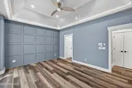 115 Windy Point, Sneads Ferry, NC 28460 — 3-bedroom home in Sea Pines North Shore, Sneads Ferry, NC, photo 24 of 42: PrimaryBedroom-decoWall115WindyPoint-37