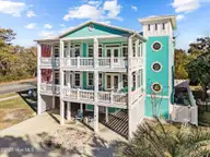102 SE 68th Street, Oak Island, NC 28465 — 4-bedroom home in Oceanside at Oak Isl, Oak Island, NC, photo 1 of 78: 64-web-or-mls-DJI_20250217152414_0464_D