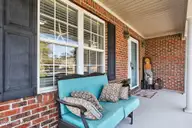 125 Lighthouse Drive, Carolina Beach, NC 28428 — 3-bedroom home in Carolina Beach Village, Carolina Beach, NC, photo 17 of 70: Covered Front Porch