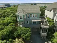 1821 S Shore Drive, Surf City, NC 28445 — 3-bedroom home in White Hills Beach, Surf City, NC, photo 1 of 52: Front Elevation