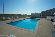 Ocean Sands, Atlantic Beach — 1-bedroom waterfront condo in Ocean Sands, Atlantic Beach, NC, photo 23 of 40: POOL LOUNGING AREA