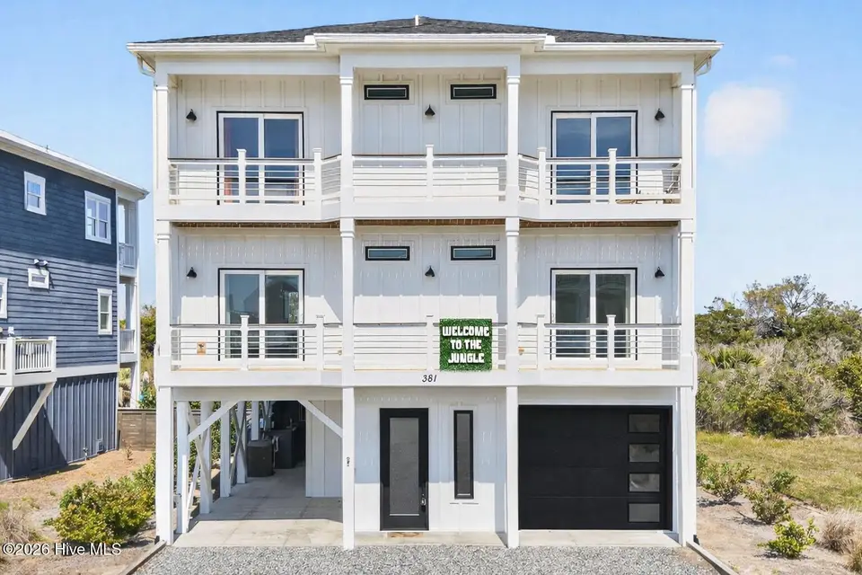 381 E Fourth Street, Ocean Isle Beach, NC 28469 — 5-bedroom waterfront home in Little Beach Landing, Ocean Isle Beach, NC, photo 1 of 62: 381 E Fourth Street