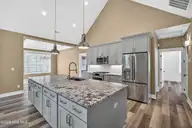 115 Windy Point, Sneads Ferry, NC 28460 — 3-bedroom home in Sea Pines North Shore, Sneads Ferry, NC, photo 19 of 42: Angledshot-DiningRoom-FridgeSideofIsland