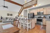 6707 Kings Lynn Drive, Oak Island, NC 28465 — 3-bedroom waterfront home in Kings Lynn, Oak Island, NC, photo 12 of 51: 6707 stairs