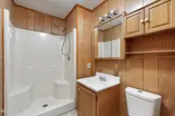 1021 Filmore Street, Southport, NC 28461 — 3-bedroom home in Boiling Spring Lakes, Southport, NC, photo 19 of 77: Primary en suite bath