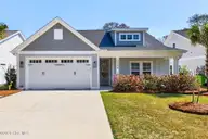 2086 Greenside Manor Drive SW, Ocean Isle Beach, NC 28469 — 4-bedroom home in The Greenside Manors, Ocean Isle Beach, NC, photo 3 of 59: Front