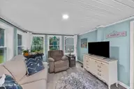 721 Blue Sail Drive SE, Bolivia, NC 28422 — 2-bedroom manufactured home in River Run Plantation, Bolivia, NC, photo 8 of 59: 33_sun room