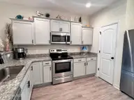 14 Catalina Circle, Swansboro, NC 28584 — 2-bedroom townhome in Hammocks Port Swansboro, Swansboro, NC, photo 6 of 31: Kitchen w. Pantry