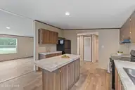 3080 Cross Street SW, Shallotte, NC 28470 — 3-bedroom manufactured home in Shell Point, Shallotte, NC, photo 11 of 35: Center Island With Storgage