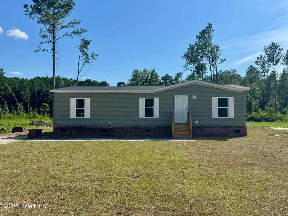 1319 Bill Hooks Road, Whiteville, NC 28472 — 3-bedroom manufactured home, Whiteville, NC, photo 1 of 24: Front of Home