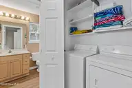 316 NE 52nd Street, Oak Island, NC 28465 — 3-bedroom home in Tranquil Harbor, Oak Island, NC, photo 22 of 49: 22_laundry