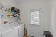 101 SW 28th Street, Oak Island, NC 28465 — 5-bedroom home in Pinners Point, Oak Island, NC, photo 22 of 56: Laundry Room