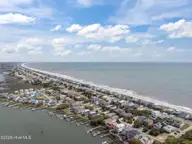3909 W Beach Drive, Oak Island, NC 28465 — 4-bedroom waterfront home, Oak Island, NC, photo 21 of 52: 8-web-or-mls-DJI_20260408140127_0411_D