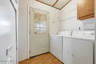2186 Forest Drive SW, Supply, NC 28462 — 2-bedroom manufactured home in Forest Hills, Supply, NC, photo 7 of 26: back door and laundry area