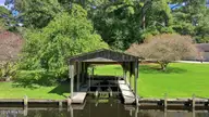 105 Dogwood Trail, Elizabeth City, NC 27909 — 4-bedroom waterfront home in Pine Lake, Elizabeth City, NC, photo 6 of 36: Boathouse