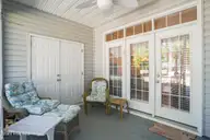 5057 Wyncie Wynd, Southport, NC 28461 — 2-bedroom townhome in South Harbour Village, Southport, NC, photo 24 of 53: 25-Screened Porch