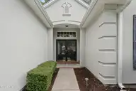 7429 Prestwick Court SW, Sunset Beach, NC 28468 — 3-bedroom home in Sandpiper Bay, Sunset Beach, NC, photo 2 of 41: Front Door