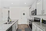 116 Norris Creek Drive, Clayton, NC 27527 — 3-bedroom home in Parrish Ridge, Clayton, NC, photo 17 of 36: Granite & Stainless Steel