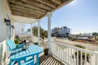 127 Sound Point Drive, Harkers Island, NC 28531 — 4-bedroom home in Cape Point Village, Harkers Island, NC, photo 3 of 56: Covered Front Porch with Waterviews