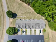 128 Wembley Drive, Clayton, NC 27527 — 3-bedroom townhome in Flowers Plantation, Clayton, NC, photo 22 of 22: drone