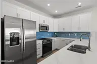 126 Shell Road, Surf City, NC 28445 — 3-bedroom waterfront townhome in Dune Ridge, Surf City, NC, photo 11 of 43: 126 Shell Rd kitchen